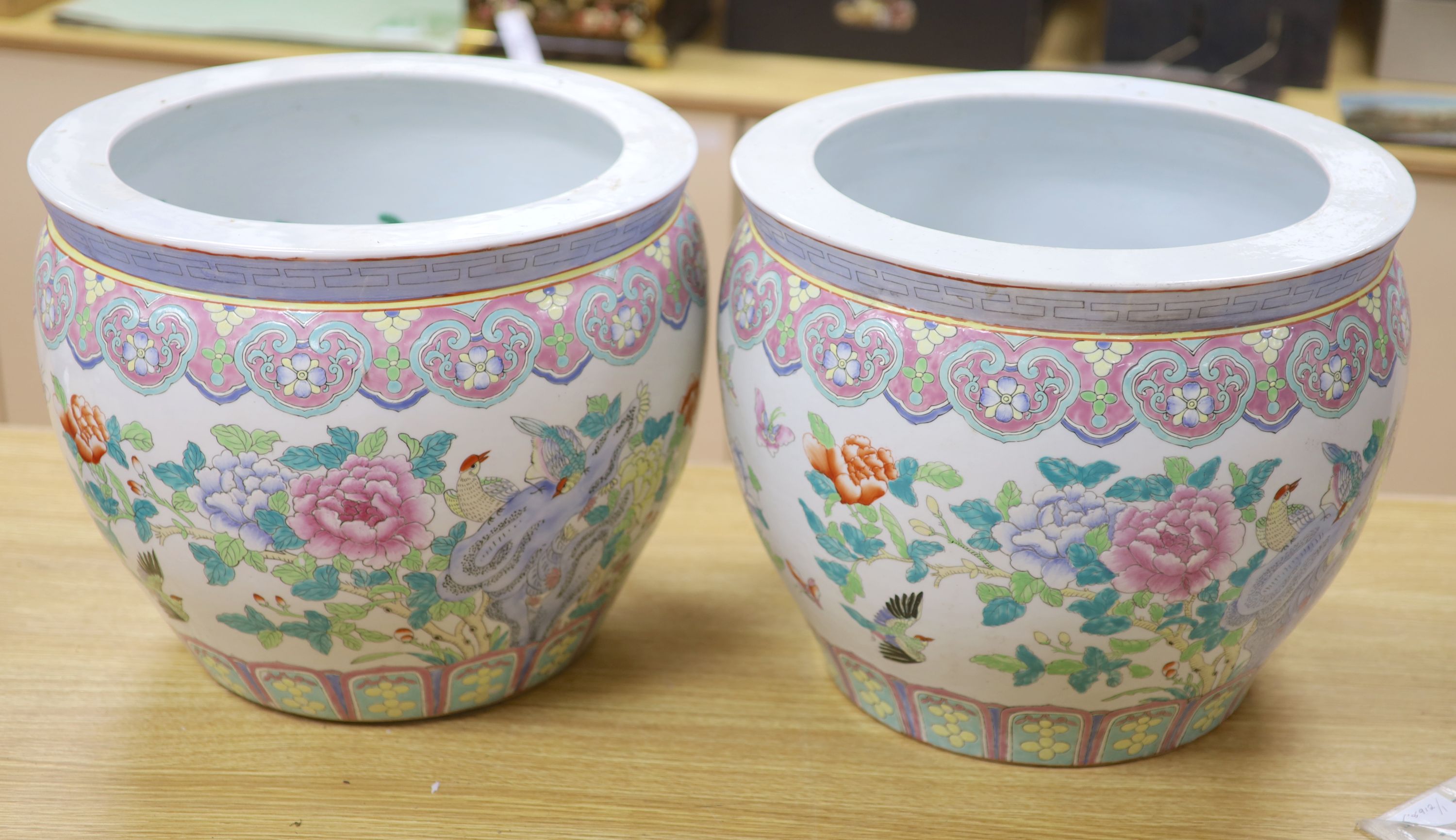 A pair of Chinese famille rose jardinieres, diameter 41cm